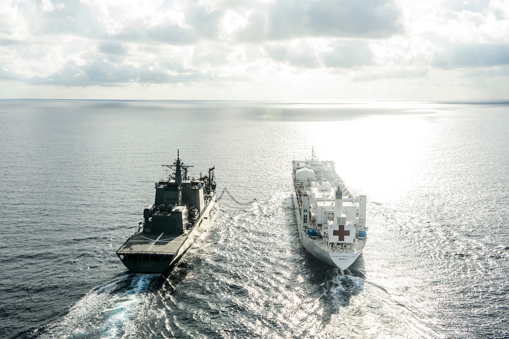 USNS Mercy and JS Mashu conduct replenishment at sea