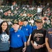 US Coast Guardsman escort veterans at baseball game