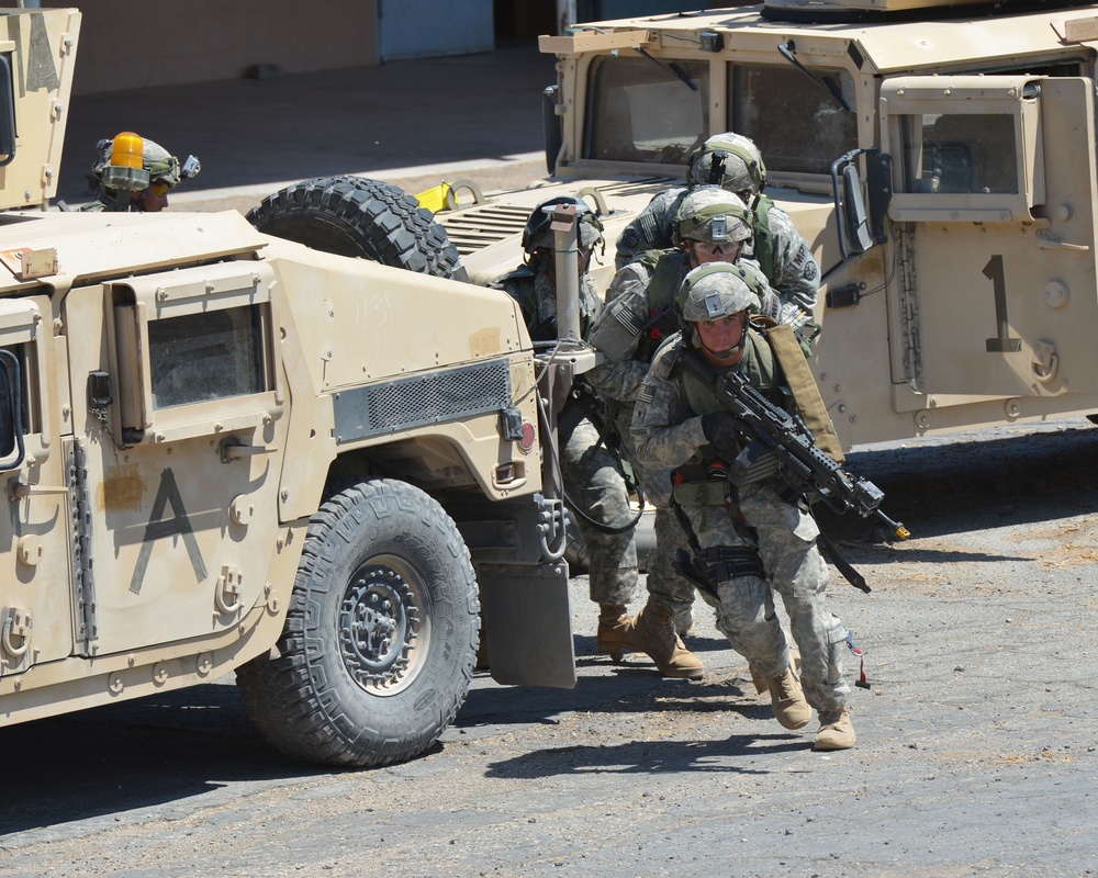 National Guard Military Police move, clear, secure during training