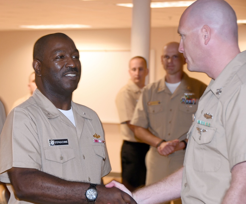 Commander, Naval Service Training Command visits with TSC chief selects