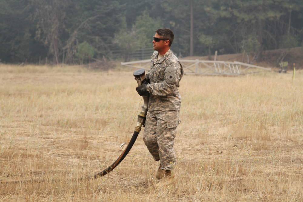 California Guard Chinooks drop water on Northern California wildfires