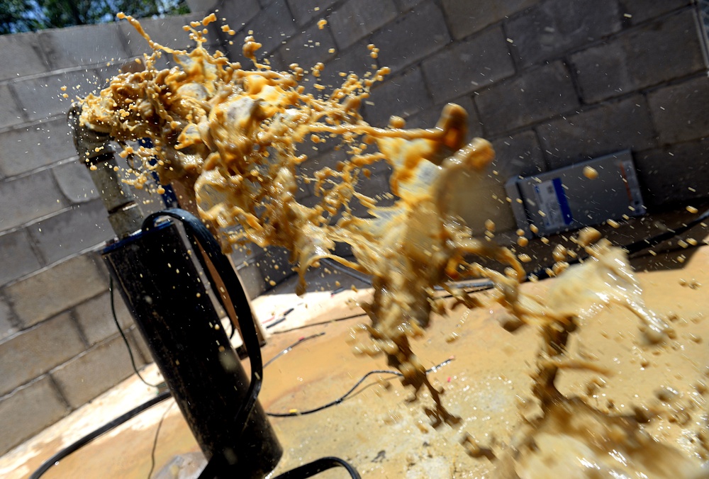 Well drillers install new pump motor and test pumps