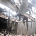 Tanks litter warehouse building after fire