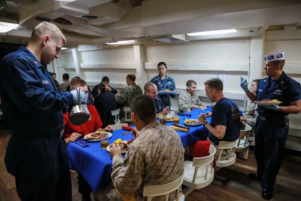 US Marines and Sailors enjoy a Birthday Meal