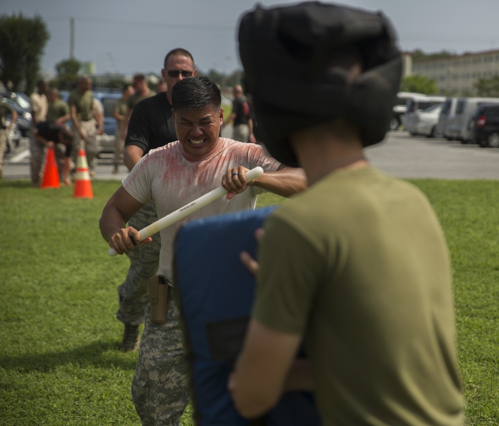 Service Members Get OC’ed to Become Non-Lethal Weapons Instructors