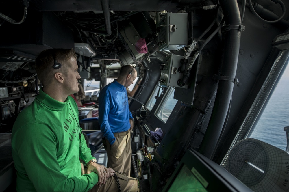 USS Essex officers monitor aircraft from primary control