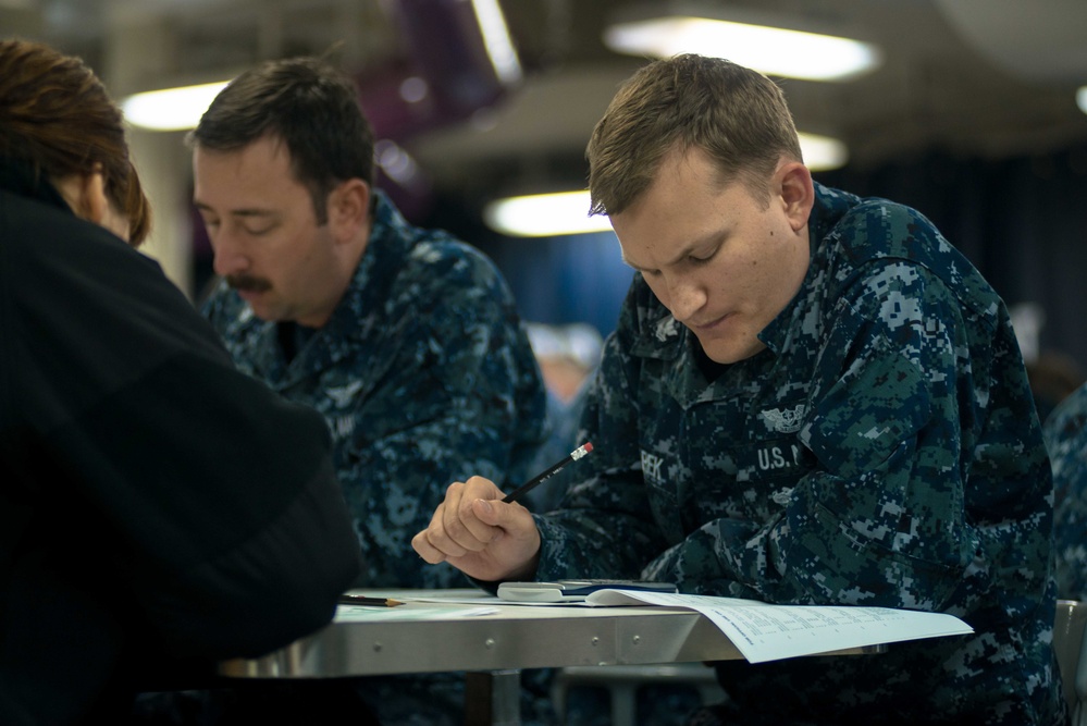 USS John C. Stennis Sailors take Navy-wide advancement exam