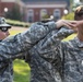 Drill sergeant teaches ROTC cadets the proper way to salute