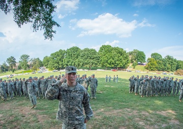 ROTC cadets salute in formation