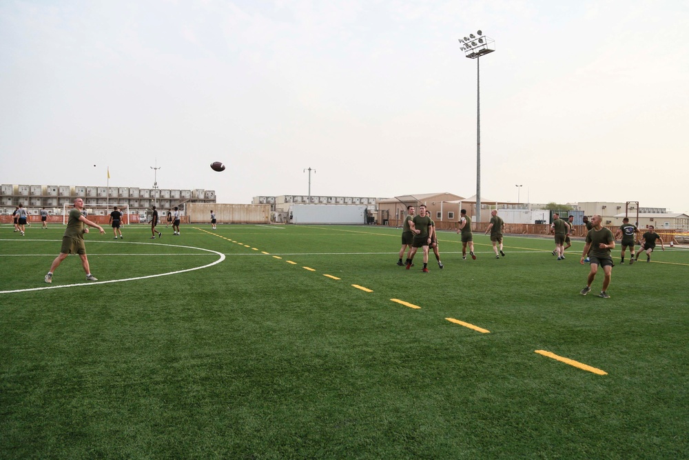 U.S. Marines play football aboard Camp Lemonnier
