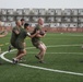 U.S. Marines play football aboard Camp Lemonnier