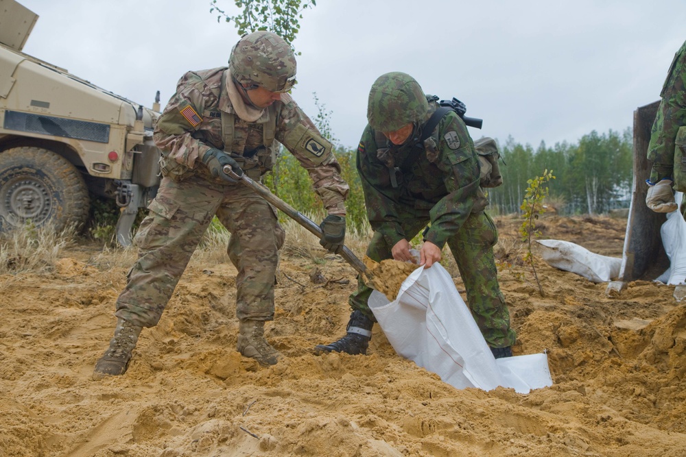 The Longest Day: Dog Company builds with sand during Exercise Engineer Thunder