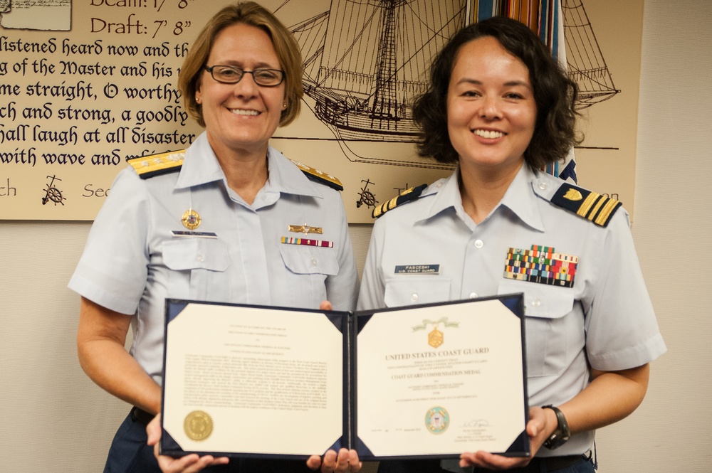 Adm. Fagan presents Lt. Cmdr. Fasceski with the Coast Guard Commendation Medal
