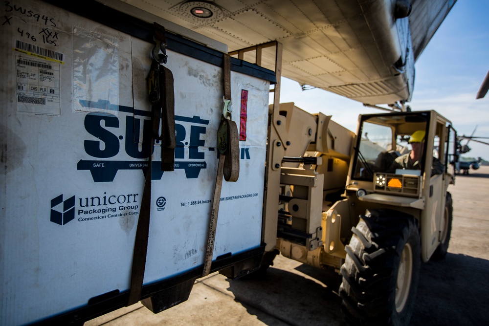 U.S. Marines with SPMAGTF-SC and Honduran Soldiers Load Medical Supplies for a Community Relations Event