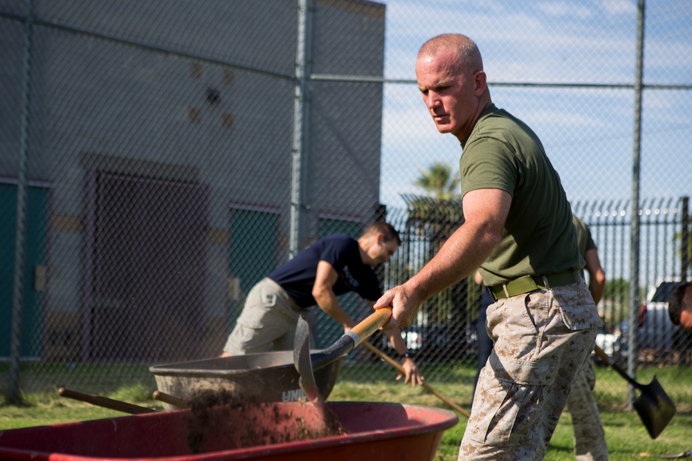 Marines participate in a community service project at David Crockett Elementary School