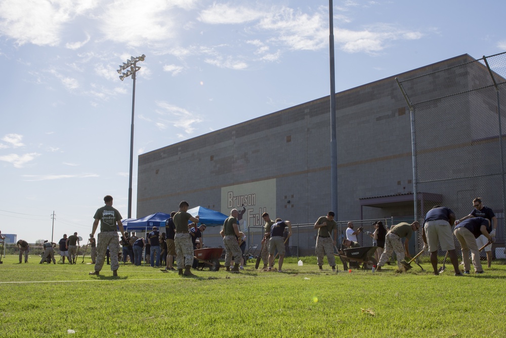 Marines participate in a community service project at David Crockett Elementary School