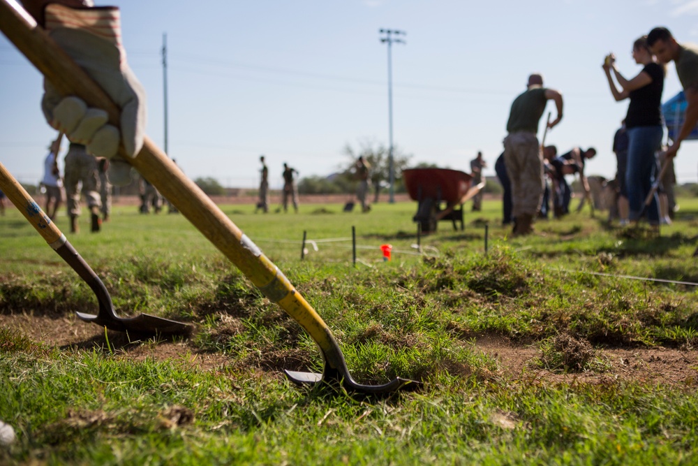 Marines participate in a community service project at David Crockett Elementary School