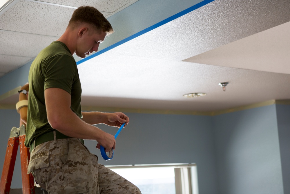 Marines participate in a community service project at David Crockett Elementary School