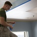 Marines participate in a community service project at David Crockett Elementary School