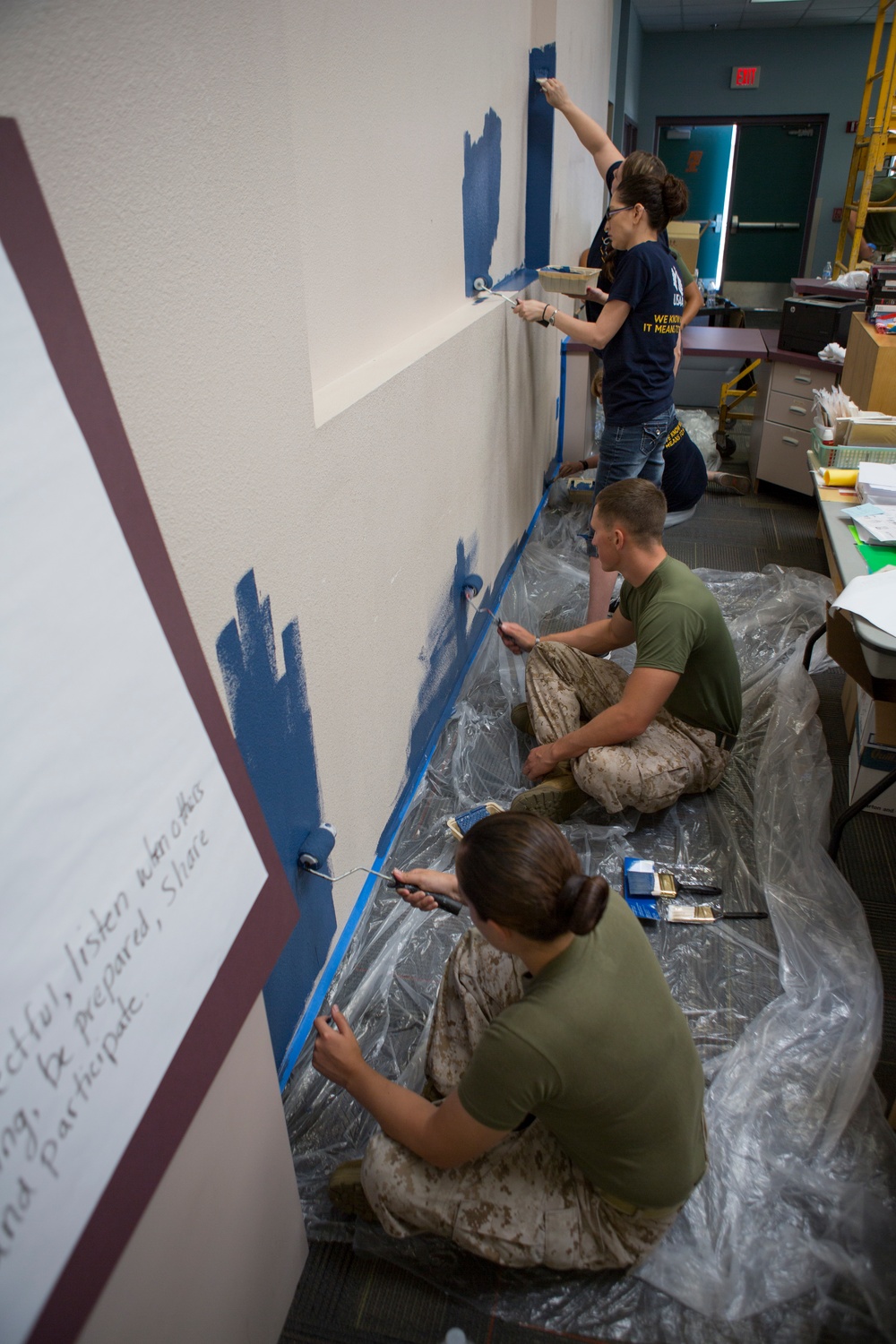 Marines participate in a community service project at David Crockett Elementary School