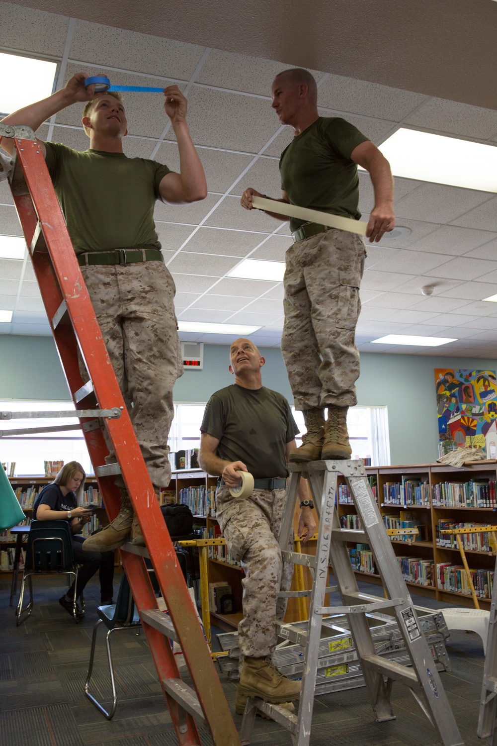 Marines participate in a community service project at David Crockett Elementary School