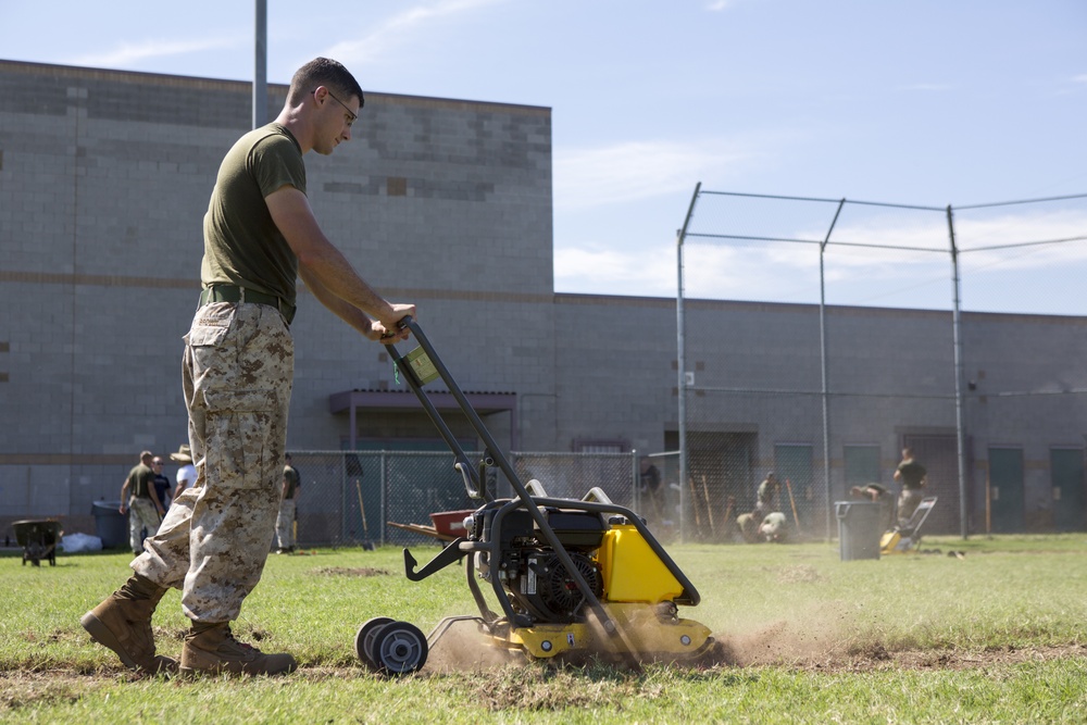 Marines participate in a community service project at David Crockett Elementary School