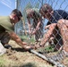 Marines participate in a community service project at David Crockett Elementary School