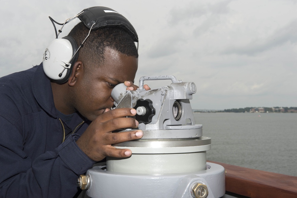 USS Carney sailor watches passing ships