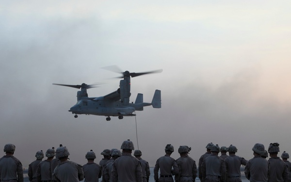 U.S. Marines fast rope from MV-22s in Southwest Asia