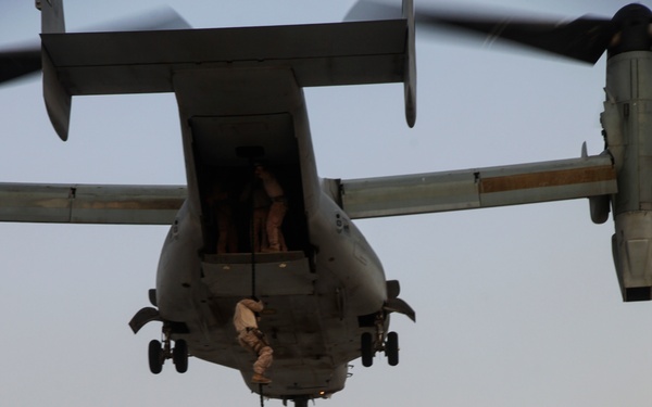 U.S. Marines fast rope from MV-22s in Southwest Asia