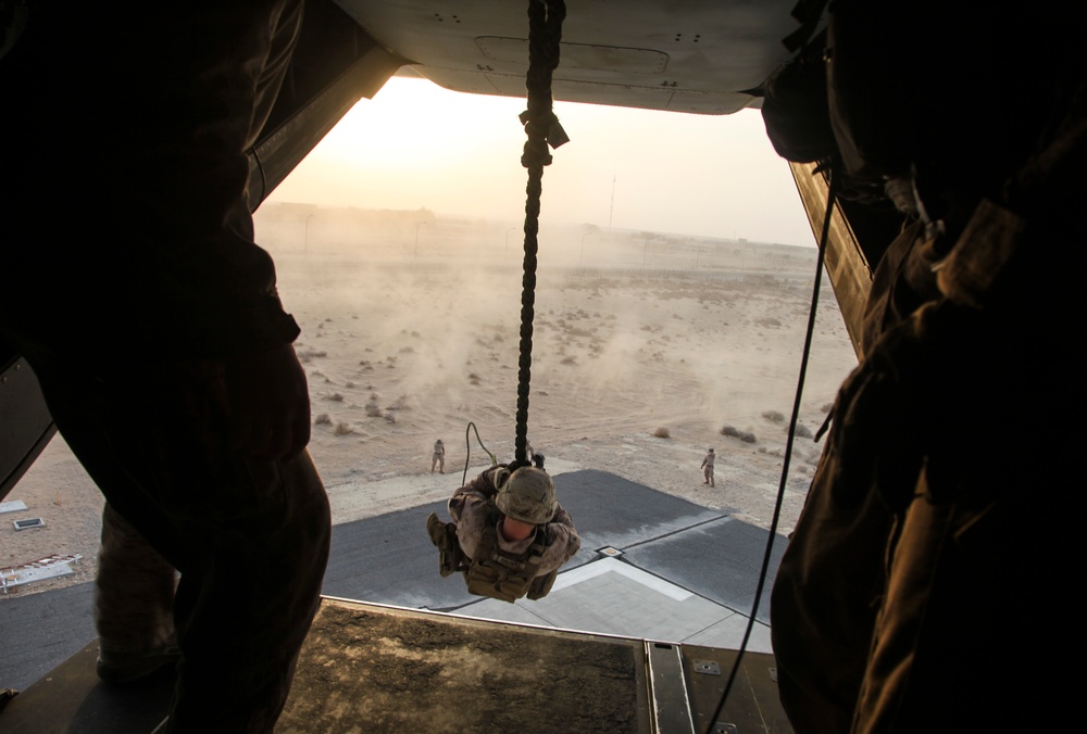 U.S. Marines fast rope from MV-22s in Southwest Asia