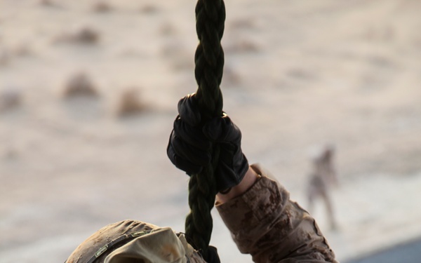 U.S. Marines fast rope from MV-22s in Southwest Asia