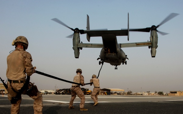 U.S. Marines fast rope from MV-22s in Southwest Asia