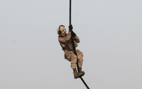 U.S. Marines fast rope from MV-22s in Southwest Asia
