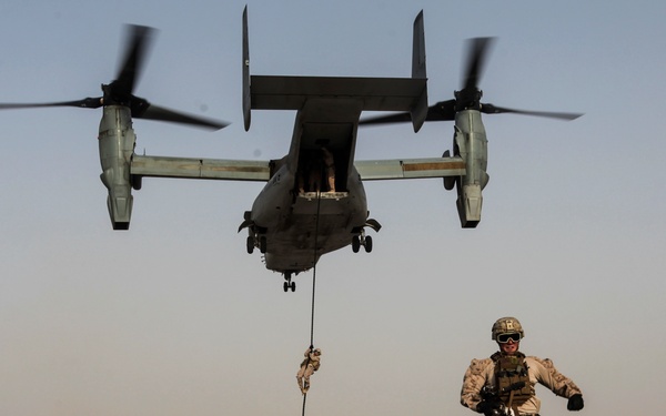 U.S. Marines fast rope from MV-22s in Southwest Asia