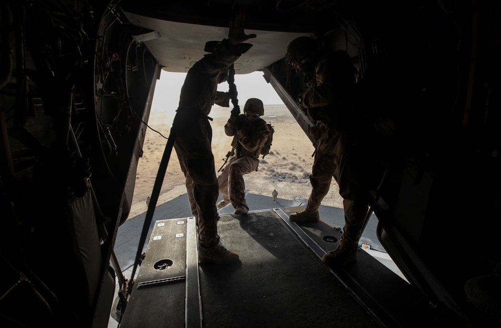 U.S. Marines fast rope from MV-22s in Southwest Asia