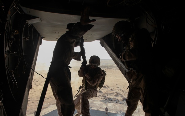 U.S. Marines fast rope from MV-22s in Southwest Asia