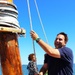 Rep. Johnny Mautz hoists the sails aboard the REBECCA T. RUARK for oyster restoration completion event