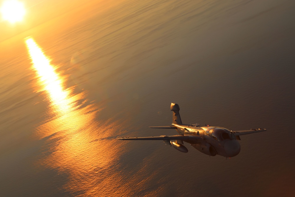 Cherry Point aircraft glide through setting skies