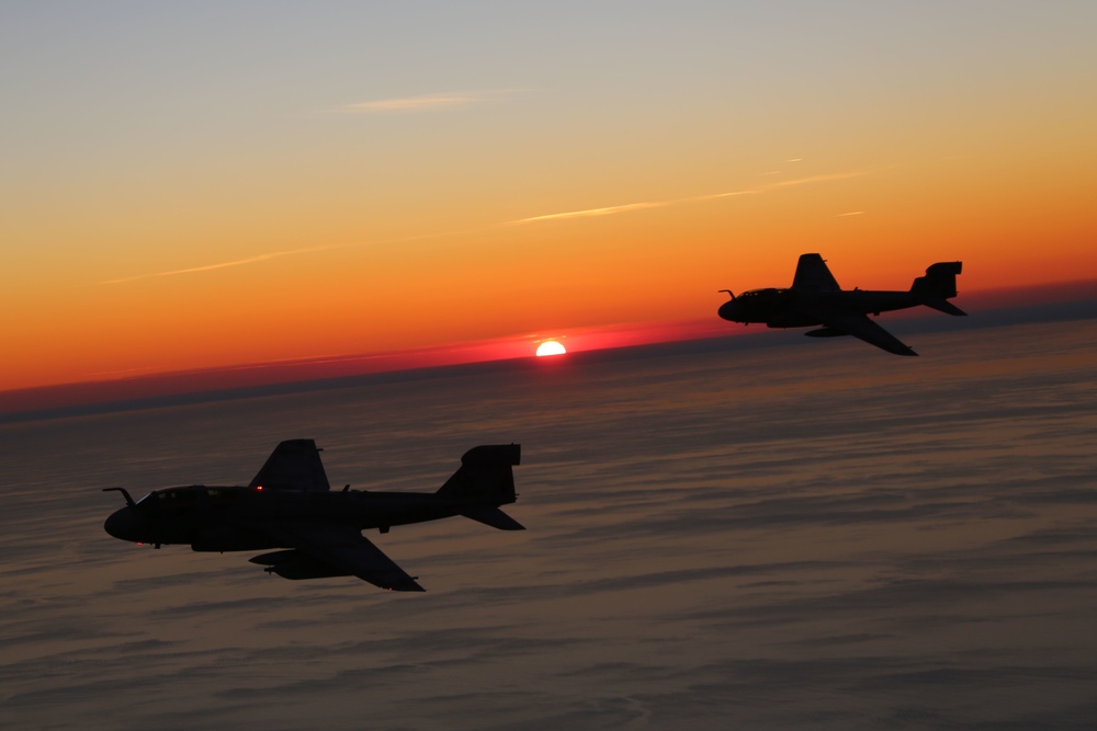 Cherry Point aircraft glide through setting skies