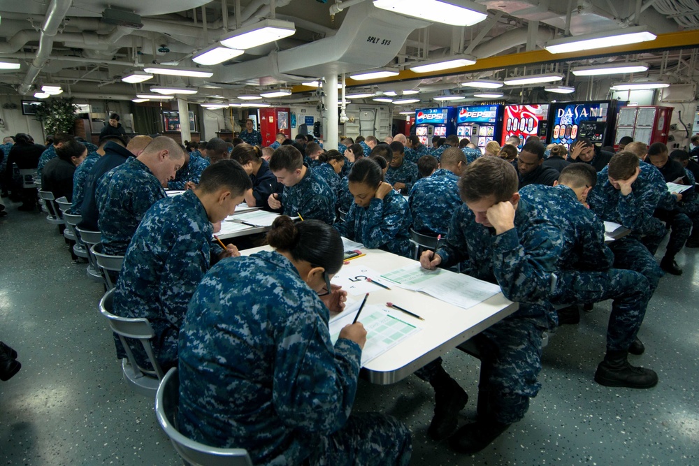 USS John C. Stennis Sailors take advancement exam