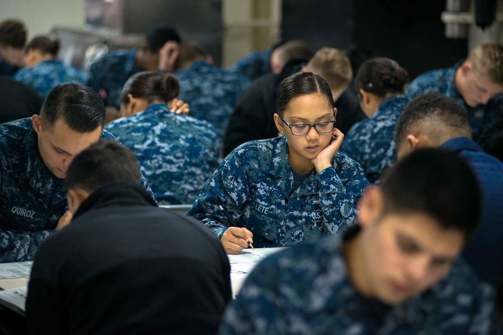 USS John C. Stennis Sailors take advancement exam