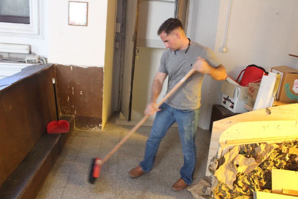 Marines, sailors don their aprons, serve at Sicilian soup kitchen