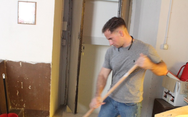 Marines, sailors don their aprons, serve at Sicilian soup kitchen