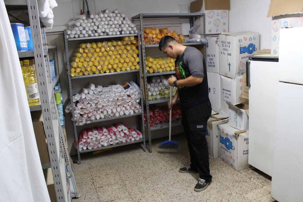 Marines, sailors don their aprons, serve at Sicilian soup kitchen