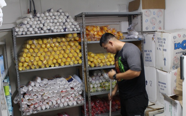 Marines, sailors don their aprons, serve at Sicilian soup kitchen