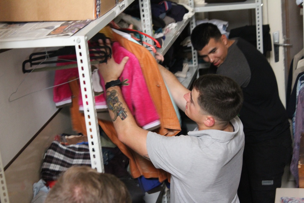 Marines, sailors don their aprons, serve at Sicilian soup kitchen