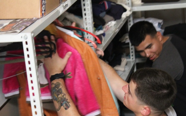 Marines, sailors don their aprons, serve at Sicilian soup kitchen