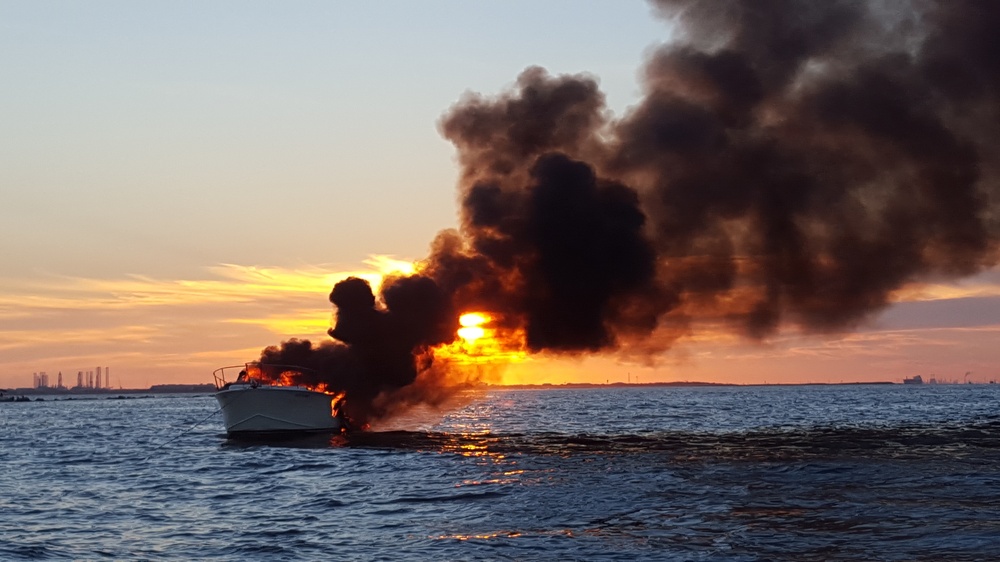 Boat burns at sunset off Galveston
