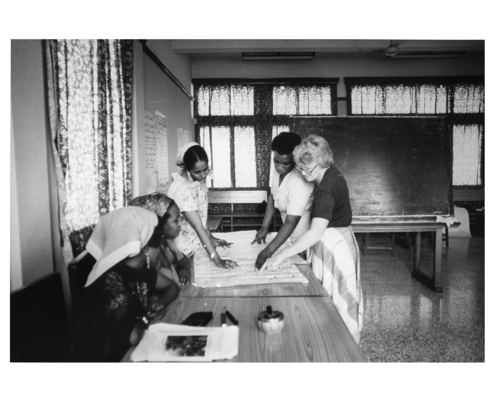 Women Working Over Map at Family Planning Seminar at a Maternal Child Health Center